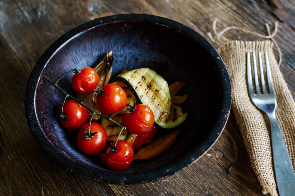 Cherry tomatoes and courgette in bowl